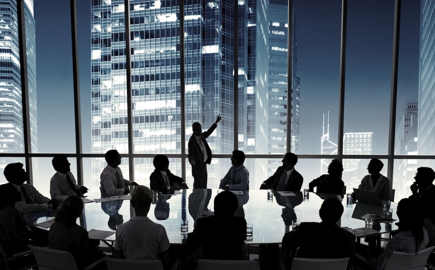 Silhouette of business people in a boardroom meeting. Image from rawpixel.com