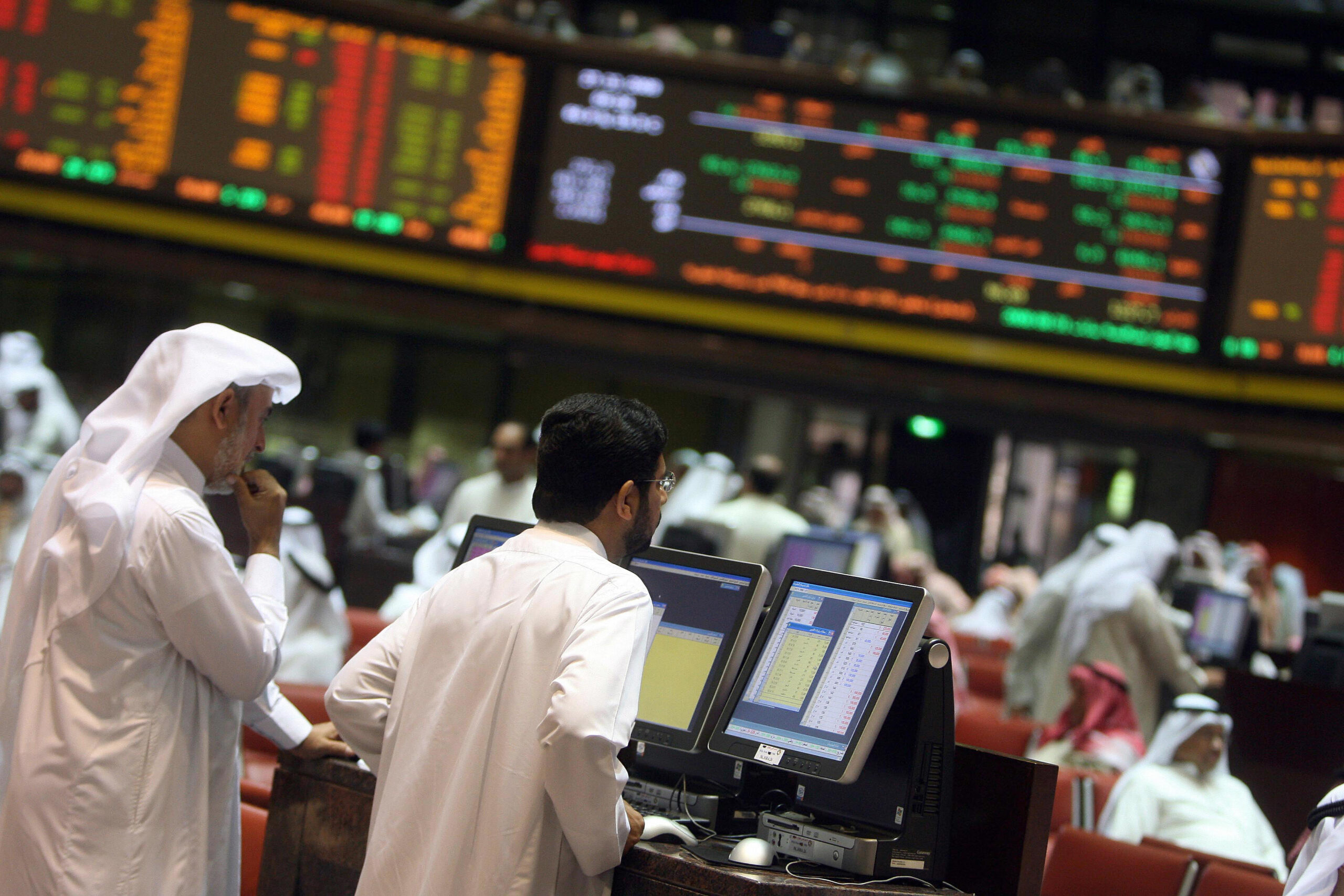 Gulf traders follow the markets (picture courtesy WAM)